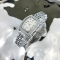 Close-up of silver tonneau quartz watch with rhinestone bezel on satin-like fluid fabric - Silver White Face
