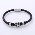 Detail of a woven leather sports bracelet with a soccer bead and magnetic clasp - Steel Color