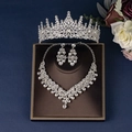 Detailed shot of silver bridal jewelry set with sparkling rhinestones and crystal crown - Silver Style (ZUHE-023S)
