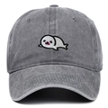 Detailed close-up of a cute seal embroidery on a vintage grey washed cotton baseball cap - Gray