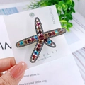 Starfish hair clip with colorful rhinestones on a Korea Jewelry design card - Starfish Multicolor