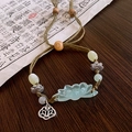 Bracelet tressé style ethnique avec pendentif lotus vert et perles en bois - Style Vintage en Résine de Lotus