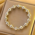 Silver beaded bracelet with vintage geometric engravings on a jewelry display box - Silver Retro Geometric Key Bracelet (X762)