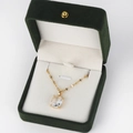 Close-up of gold chain necklace with large rectangular pendant in a green velvet gift box - Rectangle Clear Style 1 / Gold
