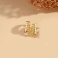 Minimalist gold-tone C-shaped hoop earrings with three rows of white pearls and metal beads - Single Row Pearl / Gold