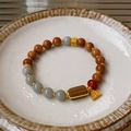 Close-up of beaded bracelet with fluorite stones and Fu character gold pendant - 8# Gold Fu Triangle Square