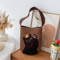 Brown canvas bucket bag featuring a cartoon cat pattern and black polka dot handle straps - Small Black Cat