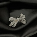 Macro close-up of a luxury bow ring set with sparkling rectangle and round crystals - Adjustable Open / Silver Bow Full Diamond