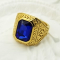 Macro shot of gold vintage Viking ring featuring a large square blue gemstone inlay - US 7 / Gold + Blue