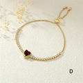 Detail of adjustable gold-plated bracelet with purple heart stone and zircon accents - Purple