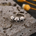 Punk style triple skull ear cuff in vintage silver finish with aged metal texture - Copper / Triple Skull / Antique Silver