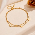 Double-layered gold chain bracelet featuring white shell Roman numeral circular charms - White Shell Roman Numerals Bracelet