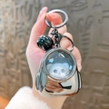 Portachiavi con orso astronauta argento con campanellino nero e anello per borse - Zaino Luminoso - Grigio