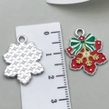 Christmas snowflake charm in red enamel with green bow and golden center detail - Red Snowflake 22x17mm