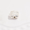 Macro view of a single S925 silver irregular hammered spacer bead for jewelry making - Medium 8mm / Silver