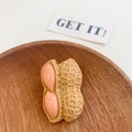 Funny peeled peanut hair clip with realistic resin texture on a wooden tray - Peanut