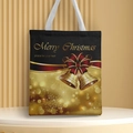 Detail of black and gold Christmas canvas tote bag with festive bell and snowflake prints - Style 9