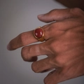 Vintage gold signet ring for men featuring a polished red oval stone on male finger - US-8 / Gold-Ruby