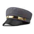 Close-up of gray twill newsboy cap with black faux leather brim and gold chain trim - M (56-58cm) / Grey with Gold Trim