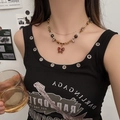 Vintage gold layered necklace with butterfly pendant and amber beads on a female model - Multi-layer Colored Zircon Butterfly Necklace