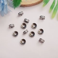 Micro-ingelegde zirkoon rondelle kralen in gunmetal op een roze achtergrond - 6mm Strass / 10 Stuks Verpakking / Zwart & Goud