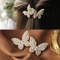 Golden double butterfly hair clip with white pearls on elegant silk background - Elegant Butterfly Pearl Spring Clip