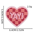 Detail of heart-shaped checkerboard embroidered patch with YAY text and dimensions - Cartoon Patch 15# (YAY! Heart)