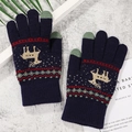 Detail of navy knit gloves with reindeer pattern and green touchscreen fingertips - Navy Reindeer