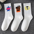 Three pairs of white cotton sports socks with blue Free and orange No Task graphics - 3 Pairs (Styles 2, 12, 13)