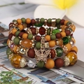Böhmisches mehrlagiges Perlenarmband-Set mit olivgrünen Kristallen und Schmetterlingsanhänger - Neuer Mix