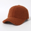 Close-up of caramel brown teddy fleece baseball cap showing thick fuzzy texture and stitching - Caramel
