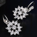 Macro shot of silver flower earrings with clear marquise cut zirconia in a cluster design - White Gold White Zircon Flower Style
