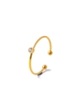 Close-up of gold stainless steel ring with white cubic zirconia and spherical end - White