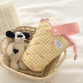 Quilted yellow checkered pencil case with pink bow and handle in a cozy home setting - Yellow