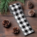 Black and white buffalo plaid linen ribbon on dark wood with pine cones and needles - Black White Grid