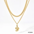 Detail of double-layer gold snake pendant necklace with textured cubic link chains - Gold