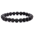 Vue détaillée des perles de pierre de lave noire naturelle avec une texture poreuse - Pierre de lave