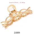 Detail of large gold metal butterfly hair claw clip showing 10.5x4cm size and spring - ZJ009 Twisted Line / Gold