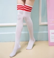Close-up of white over-knee socks with red triple stripes and soft cotton knit texture - White Red Striped