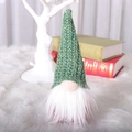 Christmas Gnome doll with green knit hat and white faux fur beard on plush background - Green
