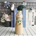 Japanese Daruma monster coin bank in khaki and green tray for desktop storage and decor - Apricot Monster Model