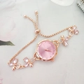 Rose gold chain watch for women featuring pink dial and crystal flower accents - Pink