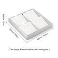 Silver jewelry display tray with 4 white slots and dimensions 19.5 x 19.8 x 2.5 cm - 4-Slot Jewelry Set Tray (White & Silver)