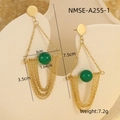 Detailed macro view of gold tassel earrings with green beads and geometric fringe - Gold Green Bead Tassel