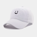 Close-up of black embroidered smiley face on white cotton vintage baseball cap - Adjustable / White