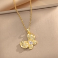 Elegant gold butterfly pendant necklace with white zircons and brushed metallic finish - Gold