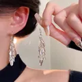 Elegant long silver leaf tassel earrings with multi-layered shimmering metallic sequins - Silver Multi-layer Tassel Sequin Pendant Earrings