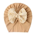 Close-up of ribbed baby turban hat featuring a gold polka dot chiffon bow detail - Light Coffee