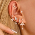 Golden ear piercing set with marquise and round white zircons on a female model - Gold Inlaid Zircon Combination Style (M-816)