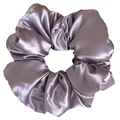 Close-up of oversized mauve satin scrunchie with smooth texture and ruffled design - Pearly Satin Mist Purple